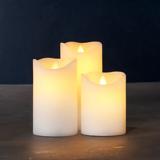 Three flameless candles with a warm glow LED Battery operated