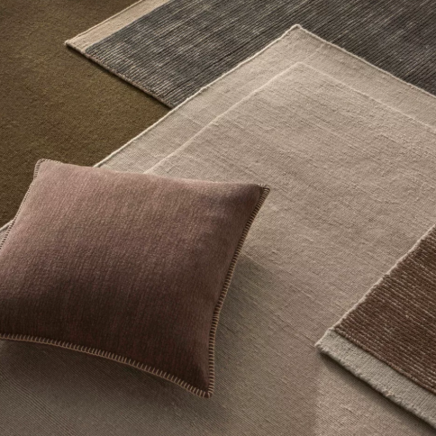 The Alba 50x50cm cushion features a soft linen-poly blend with a subtle two-tone weave and blanket stitch edging, offering relaxed texture and timeless versatility.
