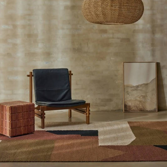Shop the Ruben Terra Rug at Comber and Comber. A handwoven jute rug featuring an earthy geometric design, available in two sizes.