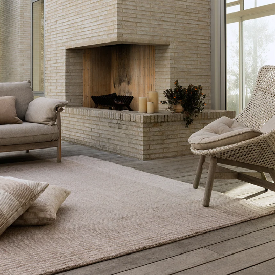 Shop the Baya Bedrock Outdoor Rug at Comber and Comber. A textured recycled PET rug for sheltered outdoor living. Available in Sand, Claret and Zinc.