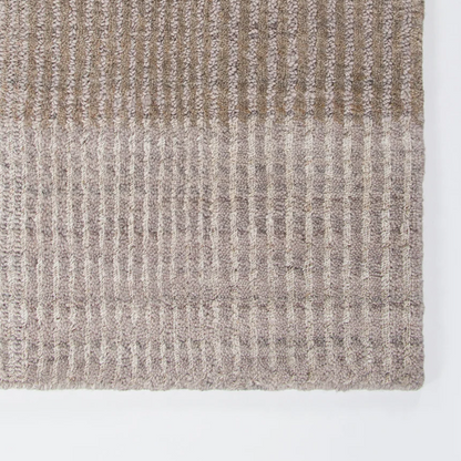 Shop the Baya Bedrock Outdoor Rug at Comber and Comber. A textured recycled PET rug for sheltered outdoor living. Available in Sand, Claret and Zinc.