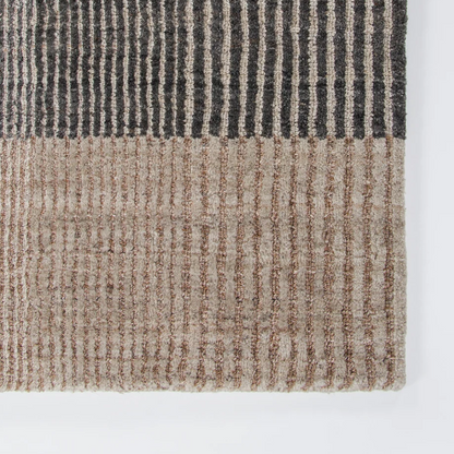 Shop the Baya Bedrock Outdoor Rug at Comber and Comber. A textured recycled PET rug for sheltered outdoor living. Available in Sand, Claret and Zinc.