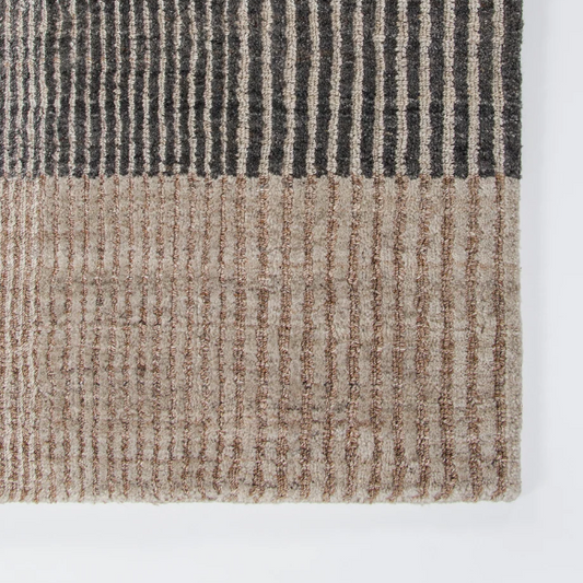 Shop the Baya Bedrock Outdoor Rug at Comber and Comber. A textured recycled PET rug for sheltered outdoor living. Available in Sand, Claret and Zinc.