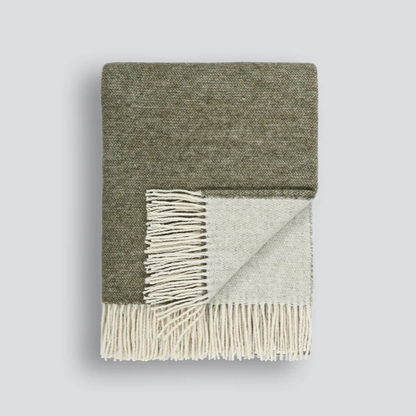 Elegant charcoal Casa Throw with natural-toned tassels
