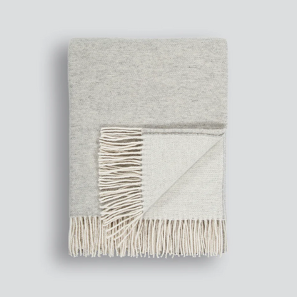 Elegant charcoal Casa Throw with natural-toned tassels