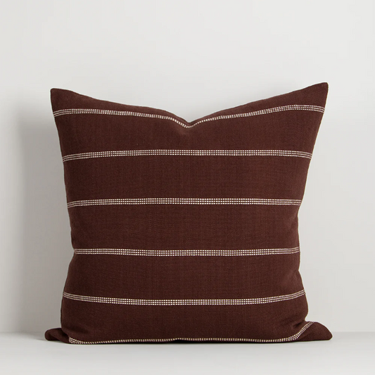 A refined jacquard-woven cushion collection featuring subtle linear detailing and rich, earthy colourways designed to bring warmth, texture, and timeless style to contemporary interiors.