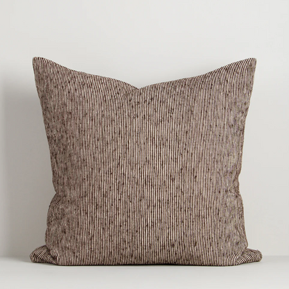 A beautifully textured cotton cushion featuring a subtle pinstripe weave and earthy colour palette, designed to bring warmth, depth, and effortless layering to contemporary interiors.