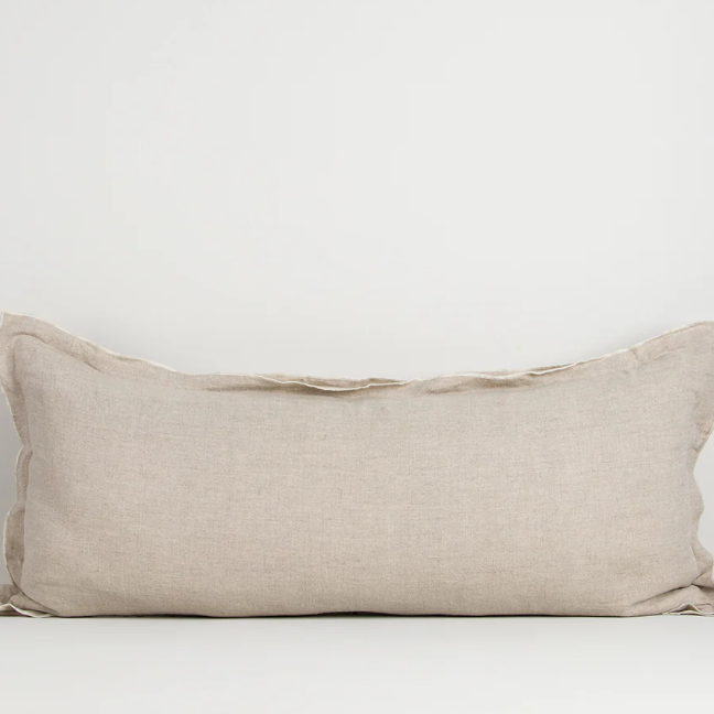 A luxurious elongated cushion crafted from 100% linen, featuring a refined double flange detail that brings texture, elegance, and effortless sophistication to any interior.