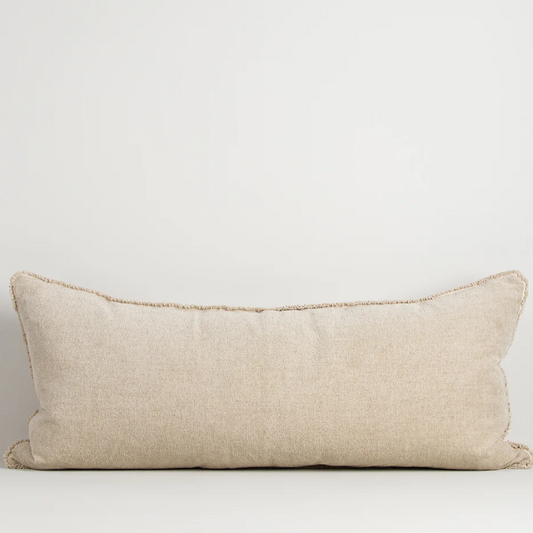 A luxurious cotton-linen chenille lodge cushion featuring a soft velvety texture, refined border detailing, and rich earthy colourways designed to bring warmth, comfort, and sophistication to contemporary interiors.