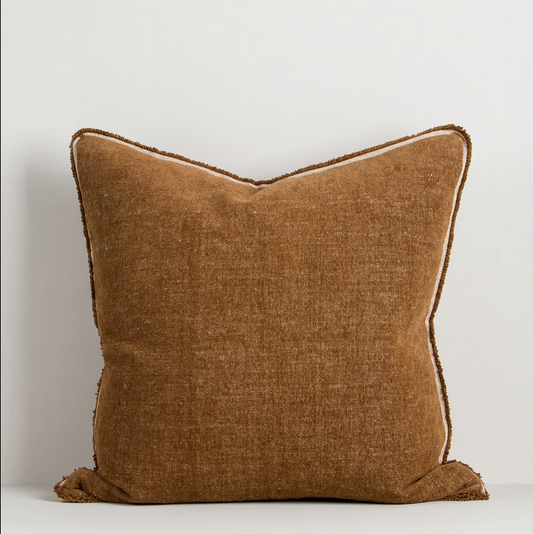 A luxurious cotton-linen chenille cushion featuring a soft velvety texture, refined border detailing, and rich earthy colourways designed to bring warmth and sophistication to contemporary interiors.