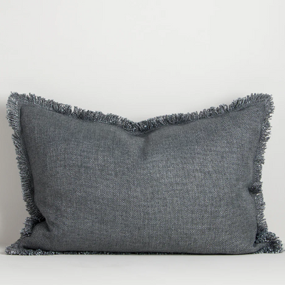 The Dover 40x60cm lumbar cushion features a thick woven texture in slate blue with soft fringing, adding warmth and understated style to any space.