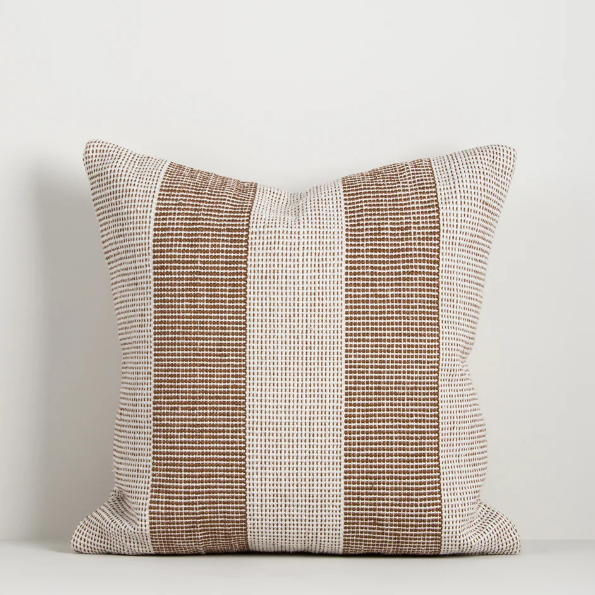 Shop the Baya Tide Outdoor Cushion at Comber and Comber. Handwoven from recycled PET with a textured linear design. Available in multiple colours.