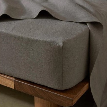 Luxury prewashed linen sheet set in soft charcoal tones