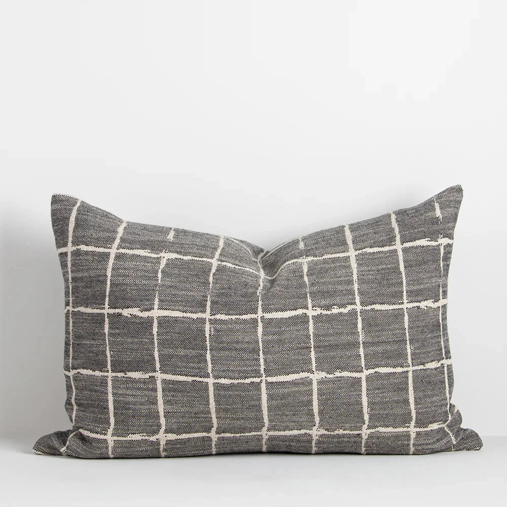 Lumbar-shaped Johnson Cushion styled on sofa or bed