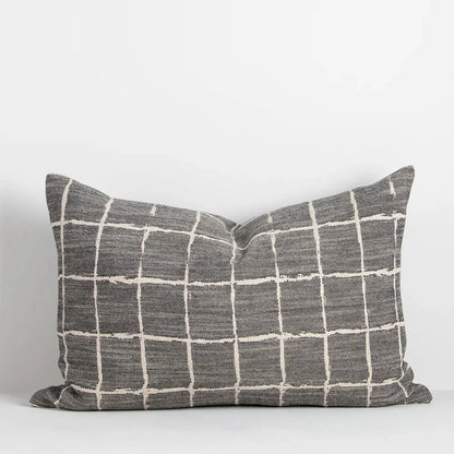 Lumbar-shaped Johnson Cushion styled on sofa or bed