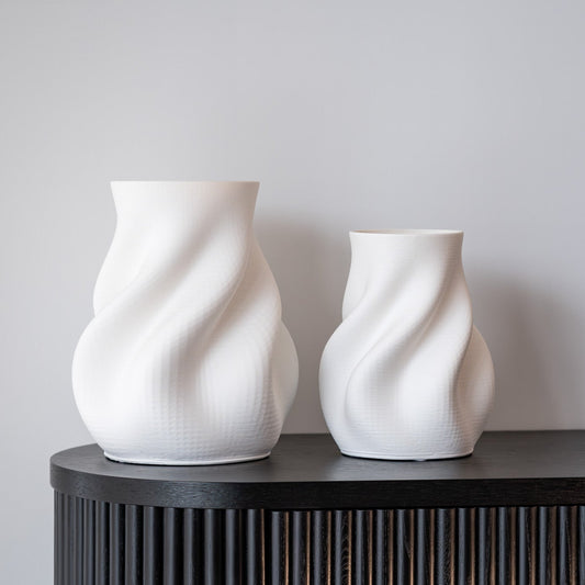 Discover the Bella Small Vase in white – a contemporary 3D printed ceramic piece with a sculptural silhouette, perfect for modern styling and decorative displays.
