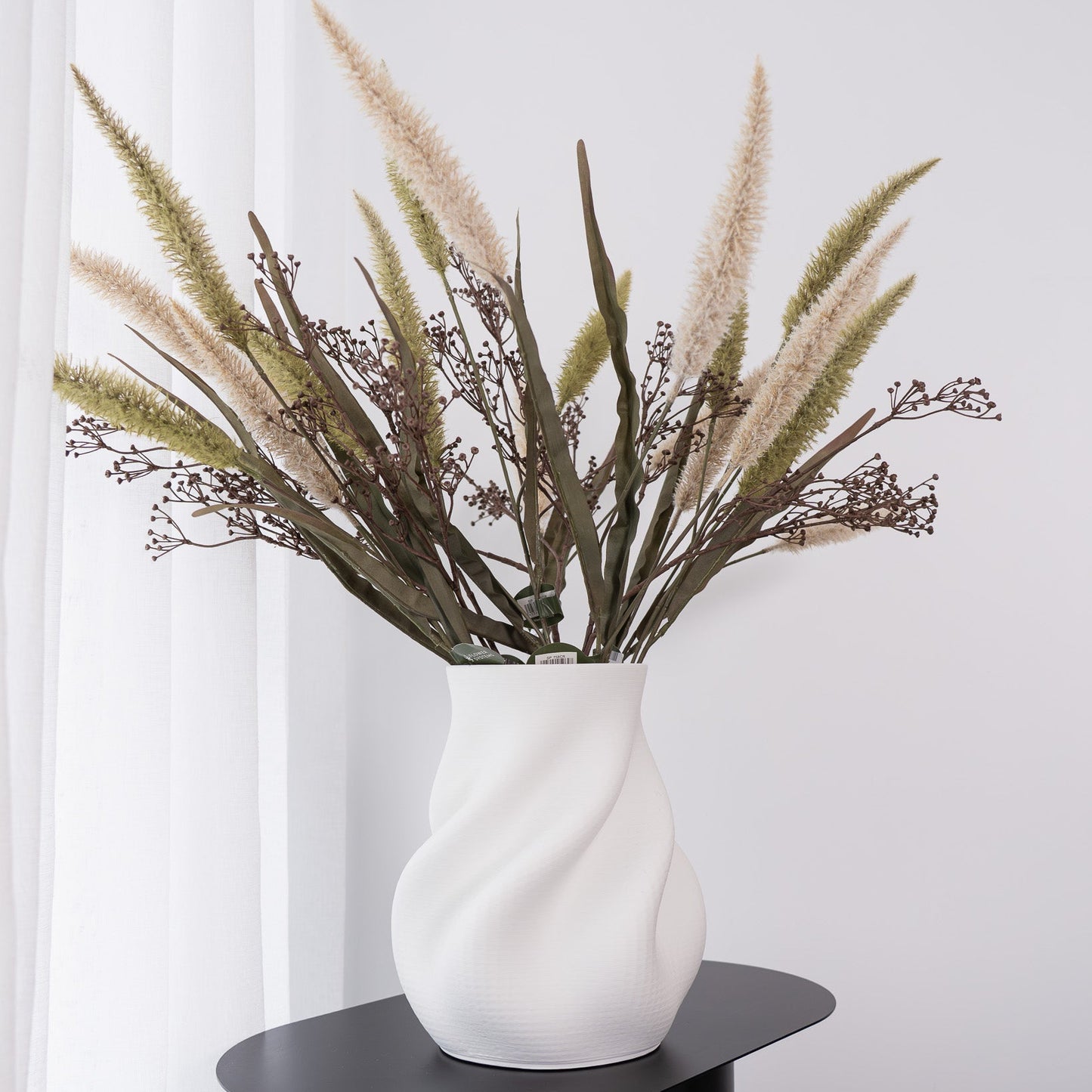 Discover the Bella Small Vase in white – a contemporary 3D printed ceramic piece with a sculptural silhouette, perfect for modern styling and decorative displays.
