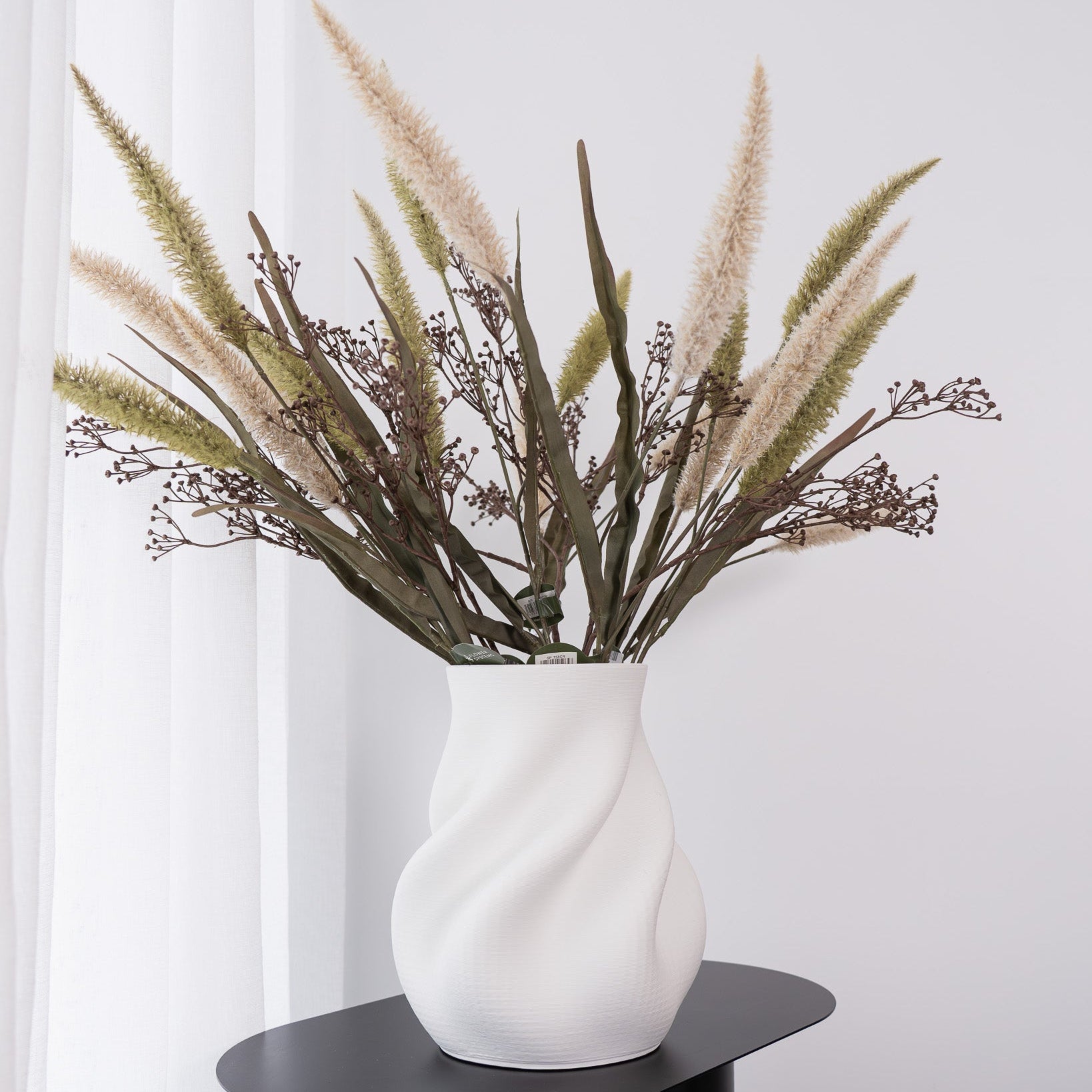 Discover the Bella Small Vase in white – a contemporary 3D printed ceramic piece with a sculptural silhouette, perfect for modern styling and decorative displays.