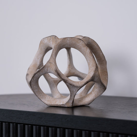 The Cosmo Decorative Sphere in resin is a modern, minimalist accent that adds texture and sophistication to shelves, tables, and layered displays.