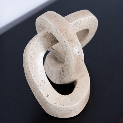 The Marley Decorative Link in resin features an interlocking sculptural design, perfect for adding modern style and texture to tables, shelves, or layered displays.