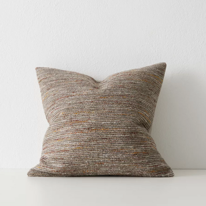 Vista cushion in textured bouclé with Sunset clay tones