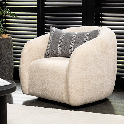 A sculptural swivel chair with deep comfort, tailored curves, and a timeless, versatile design.