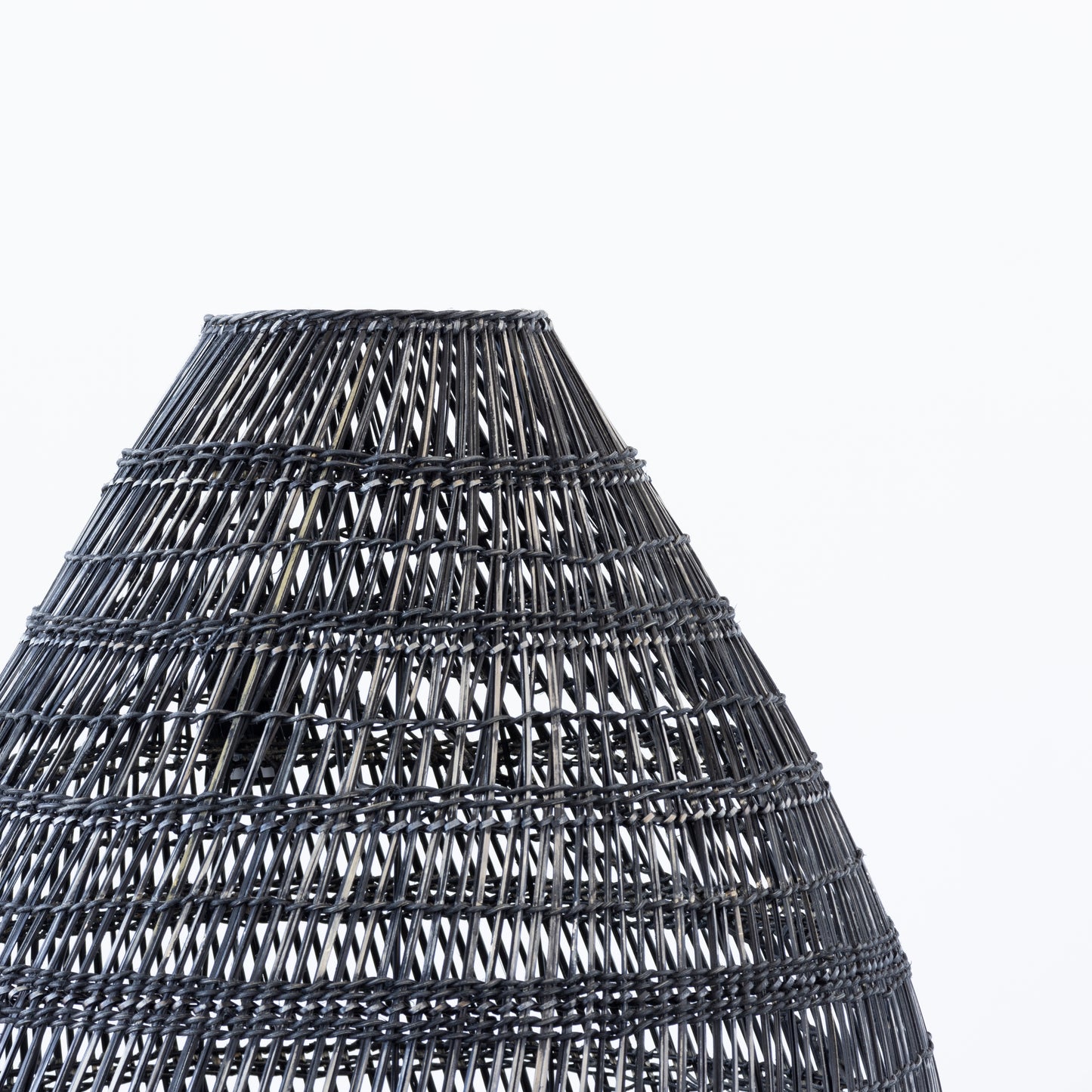 Side view of black rattan pendant light