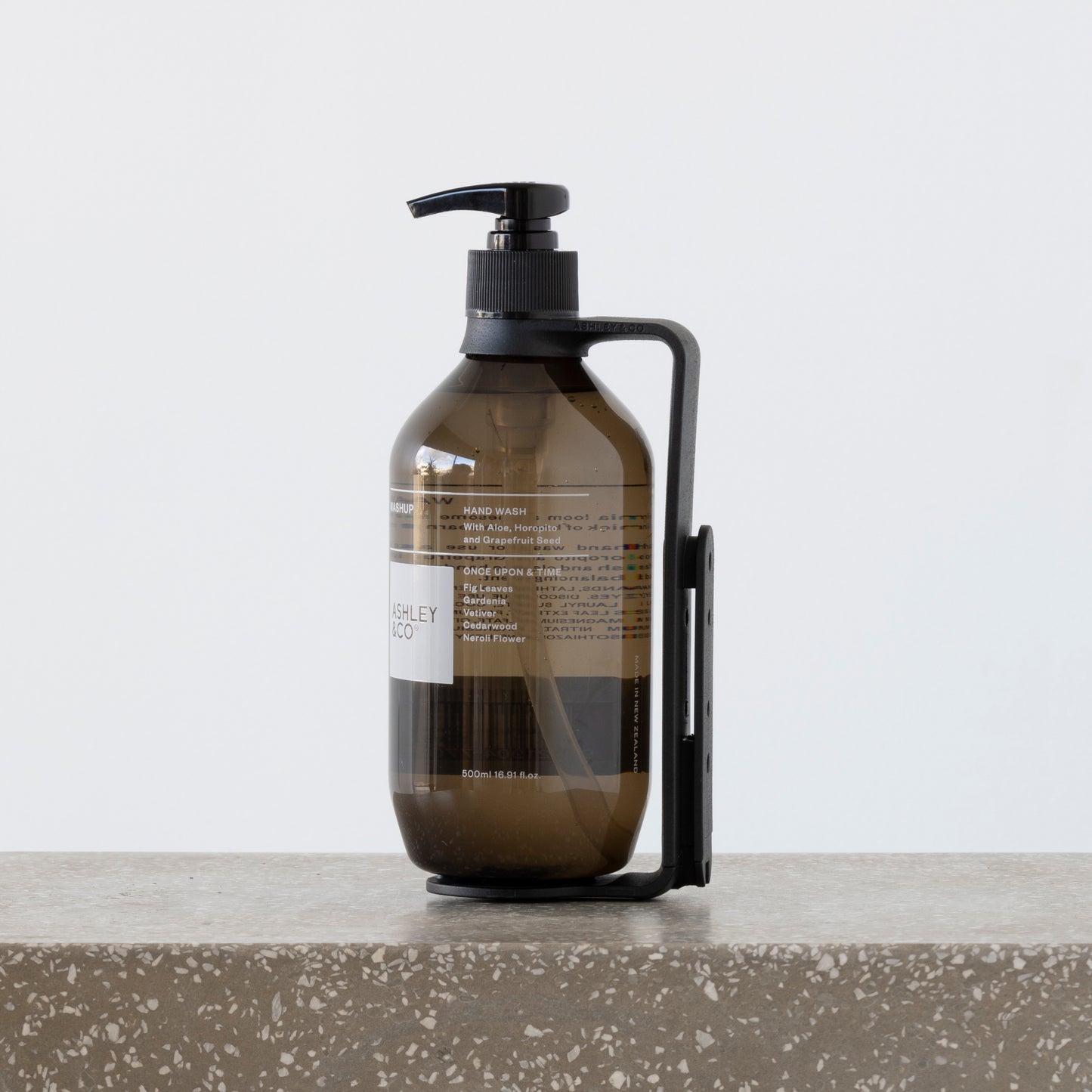 Close-up of Hold Me cradling 500ml wash and body bottles