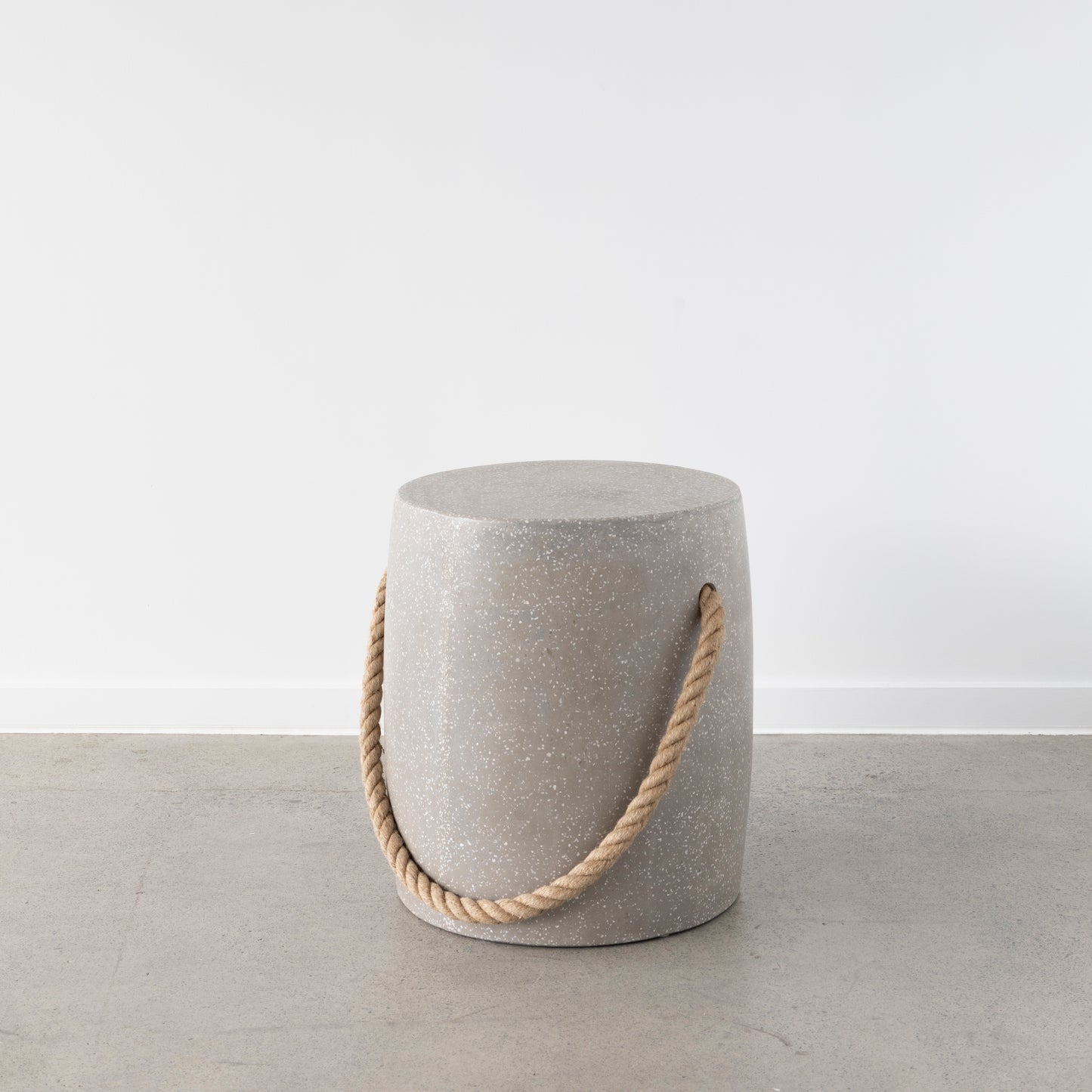 Terrazzo stool with rope accent for modern interiors