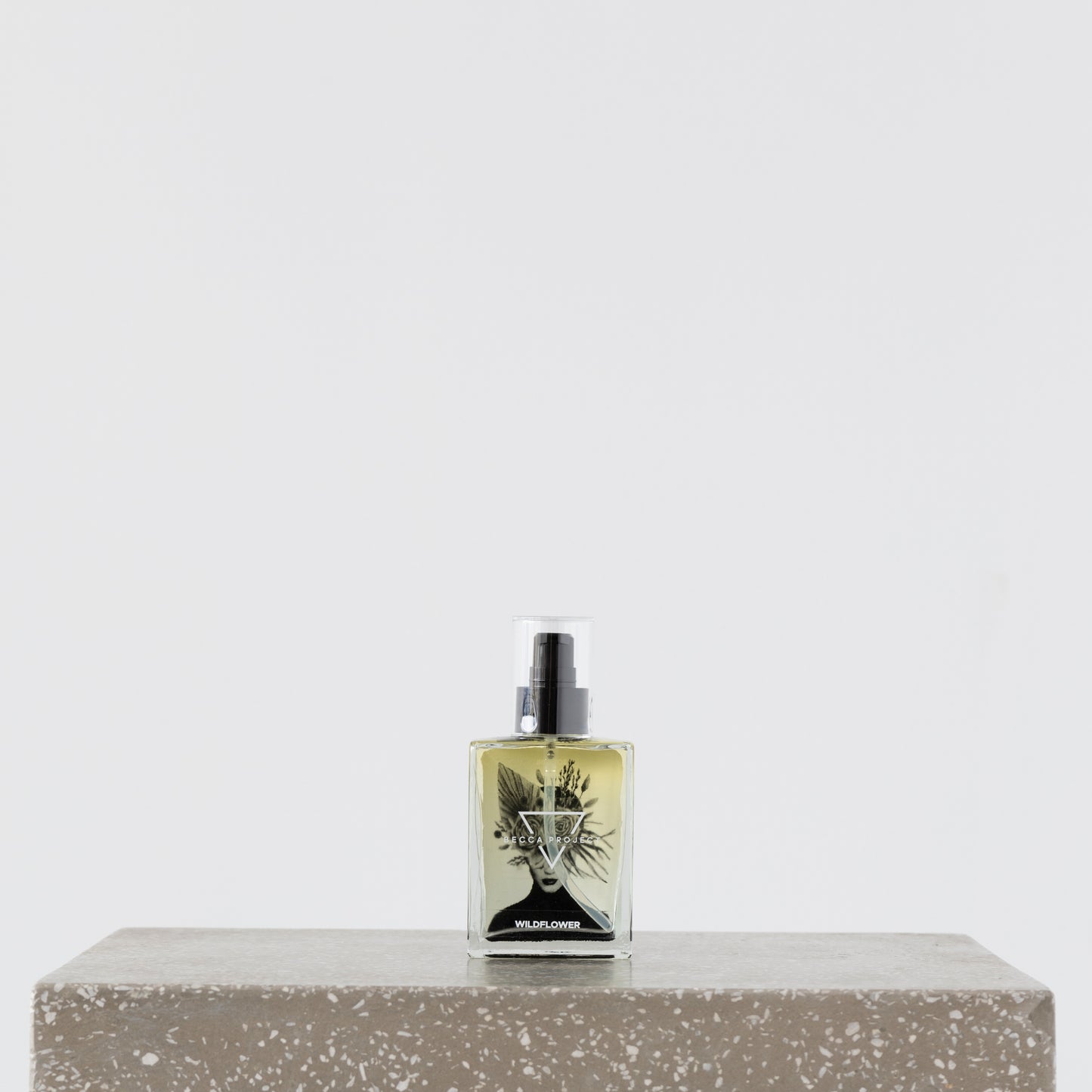 Close-up of Becca Body Oil being applied to skin