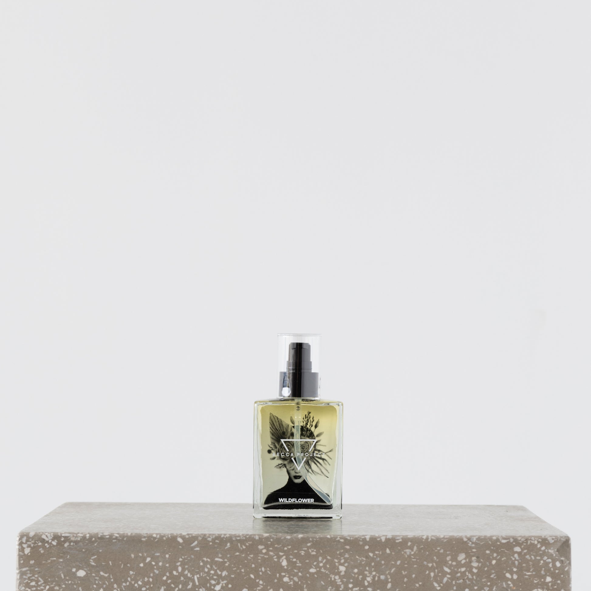 Close-up of Becca Body Oil being applied to skin