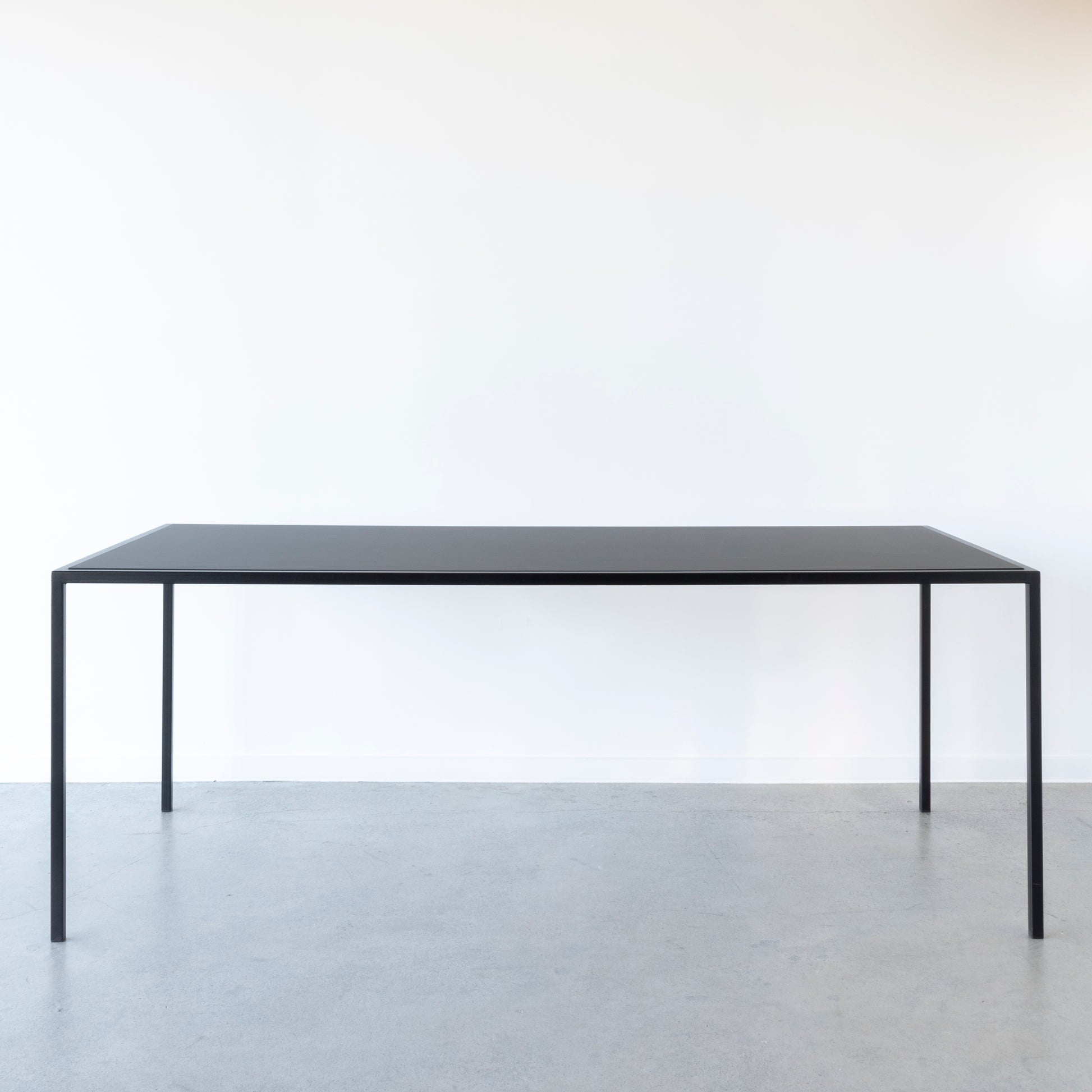 Nero Range dining table with reversible black and walnut top