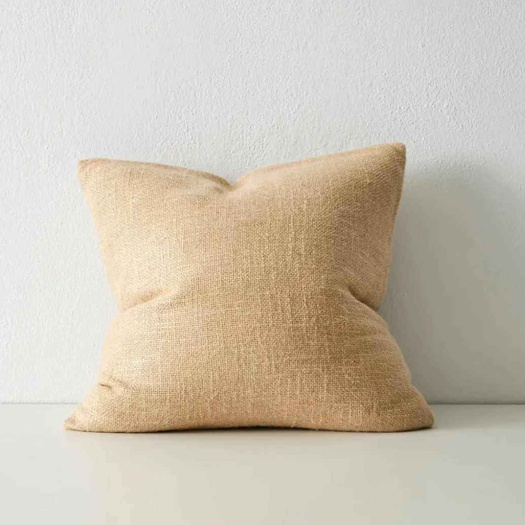 Plain woven cushion with subtle geometric pattern